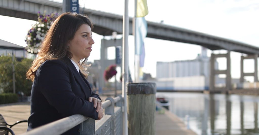 Female attorney looking out over waterfront