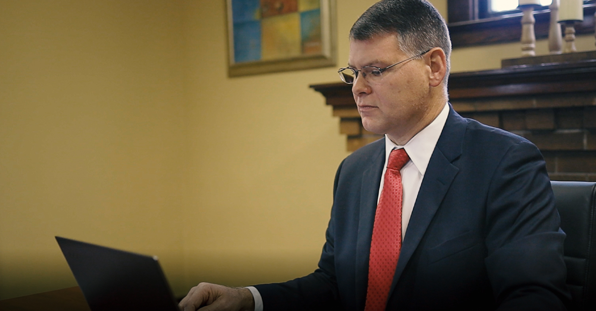 Male attorney looking at computer